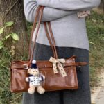 Throttle - themed Metallic - edged Brown Moto - style Handbag